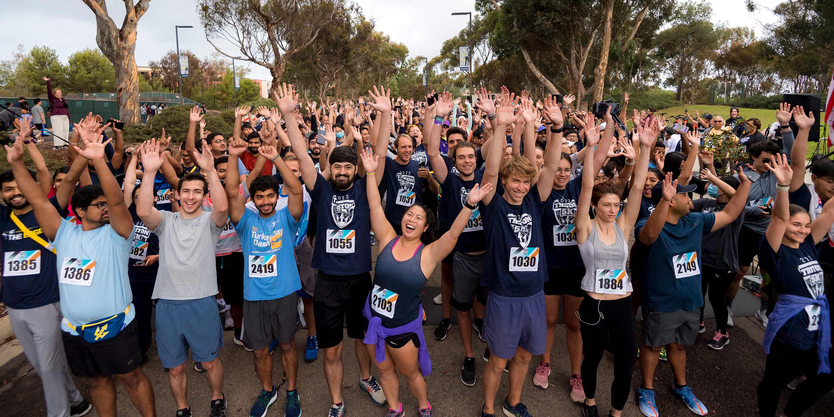 Triton Homecoming slideshow images, Triton 5k runners cheer at the starting line
