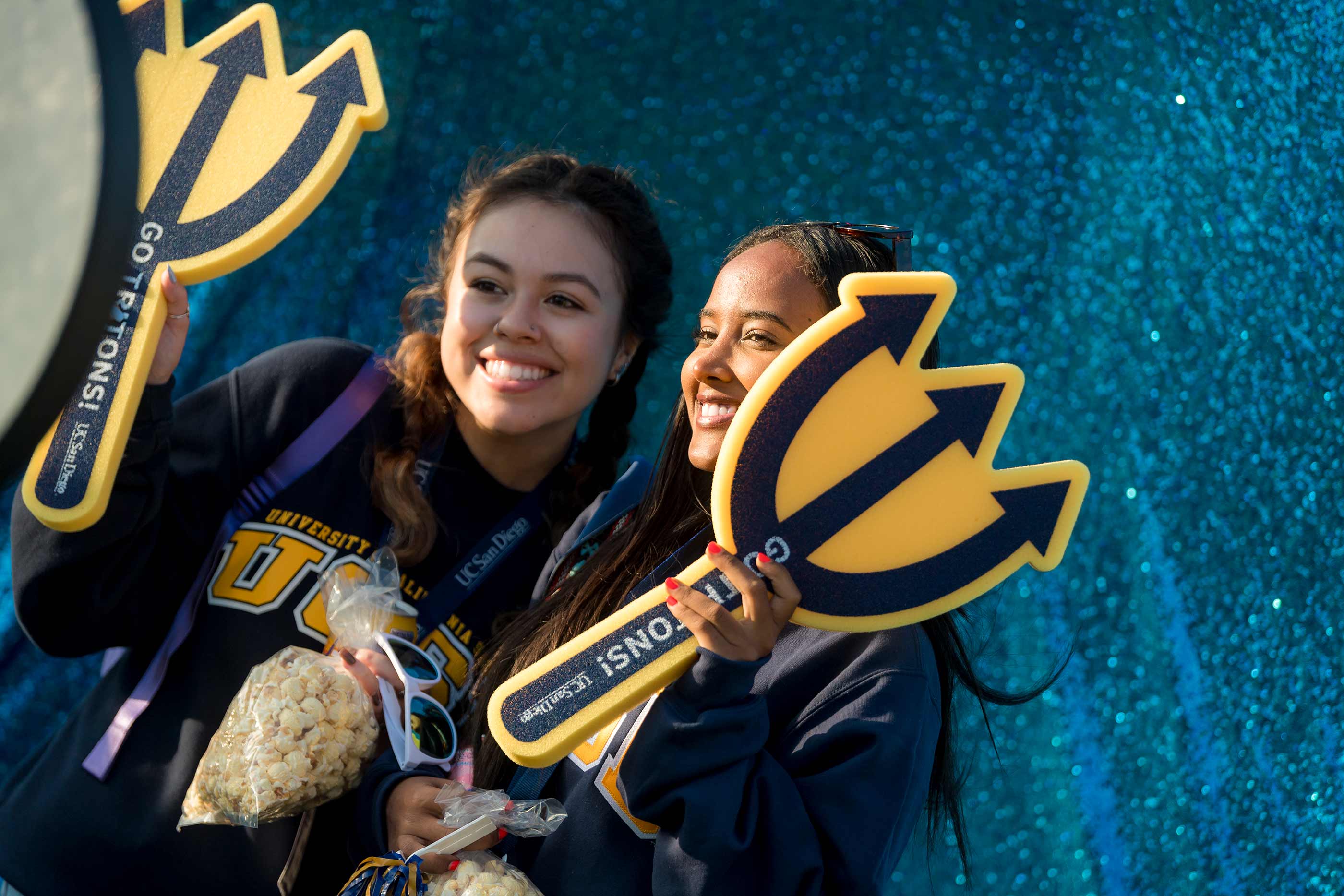Students pose for photos at photo booth. 