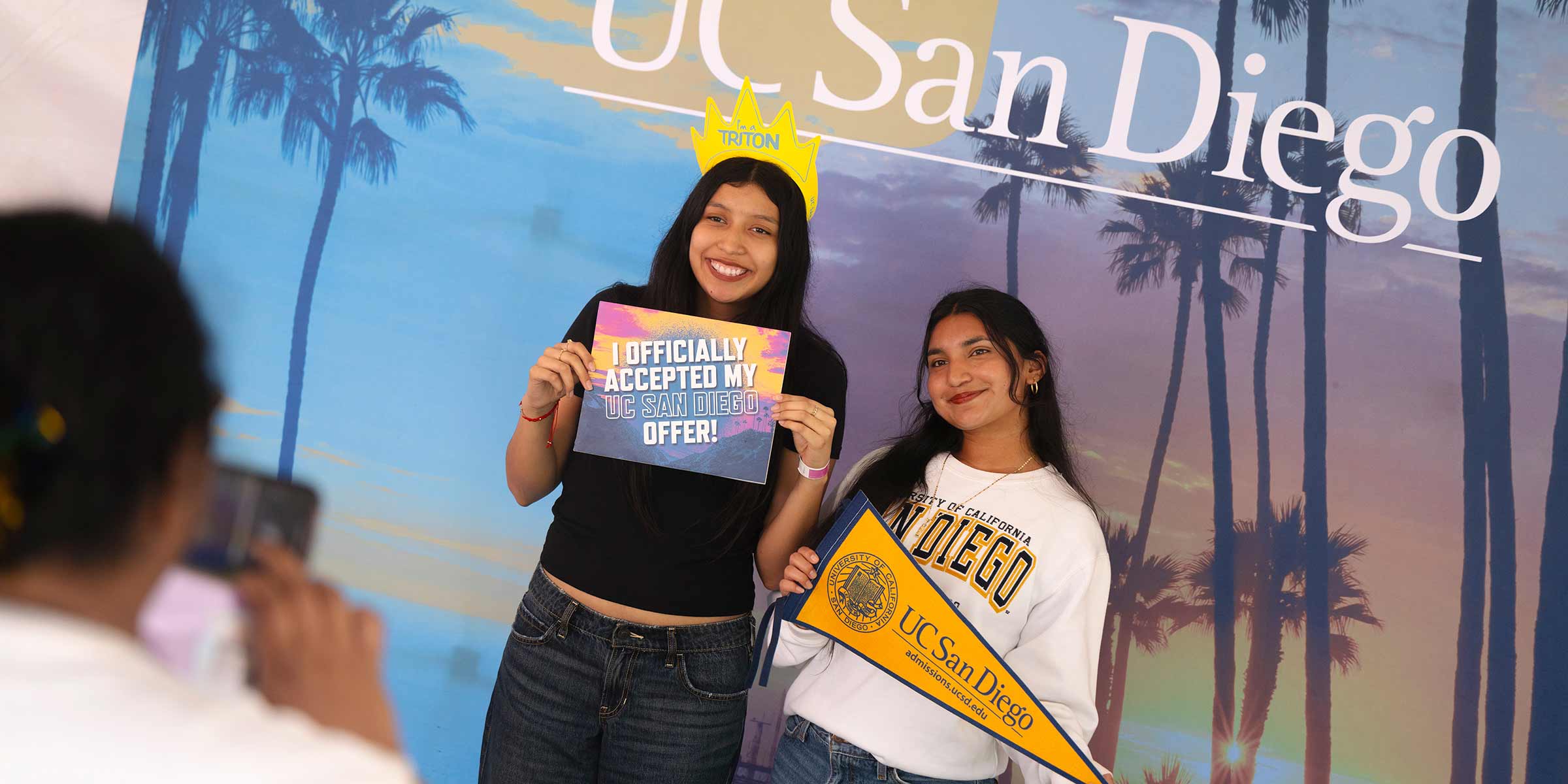 Incoming students pose for photos at the registration booth