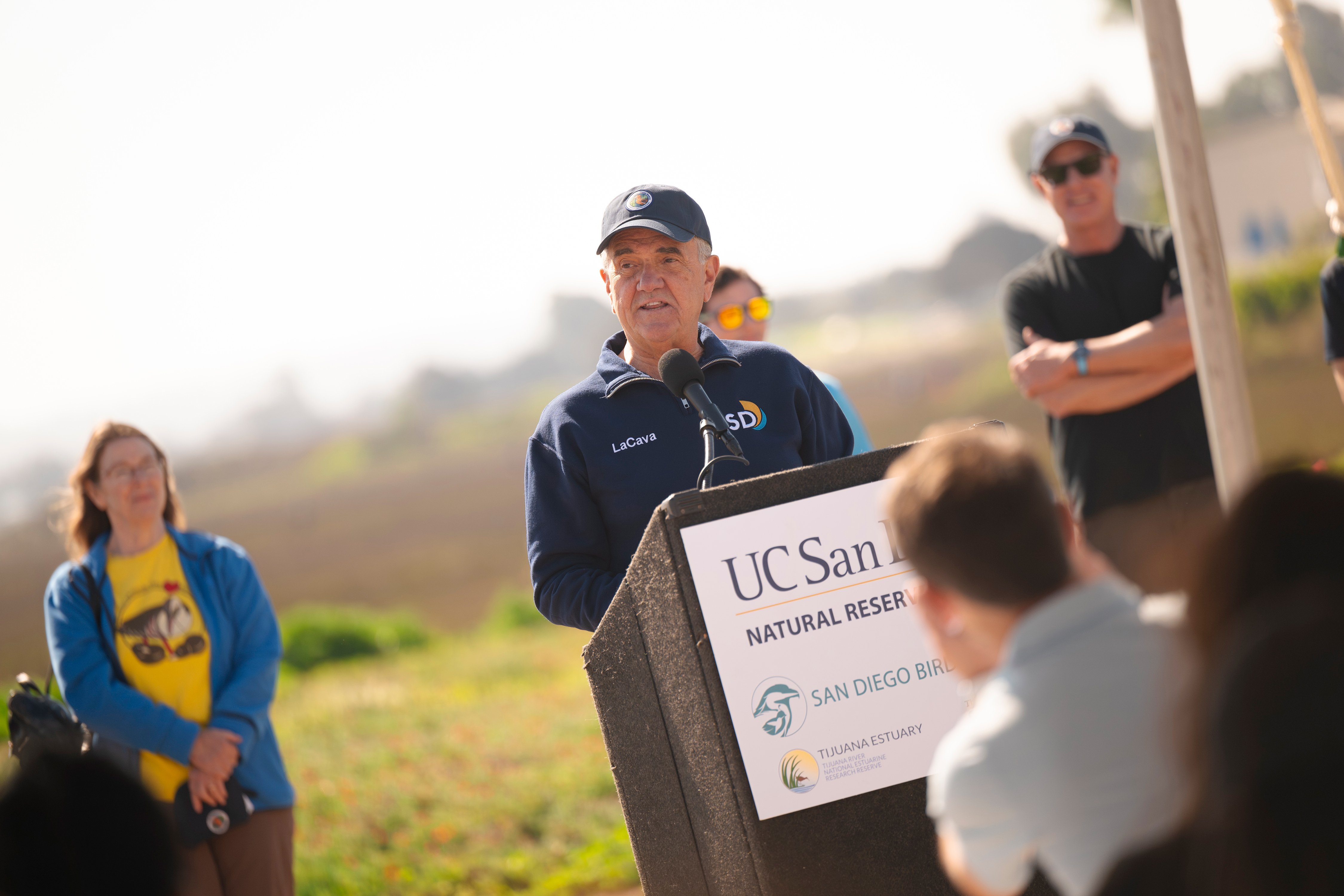 Man stands at podium.
