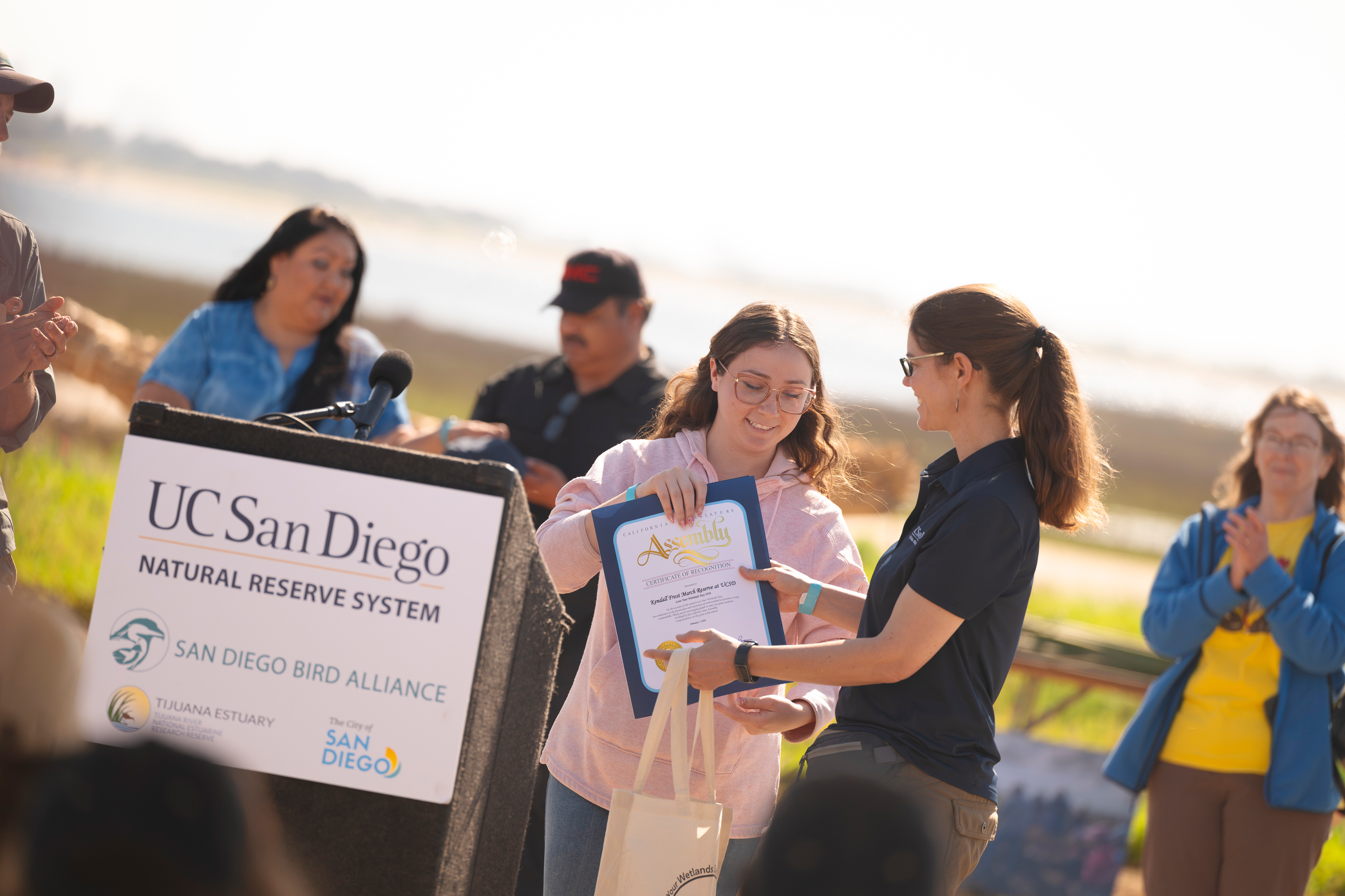 A plaque is presented.