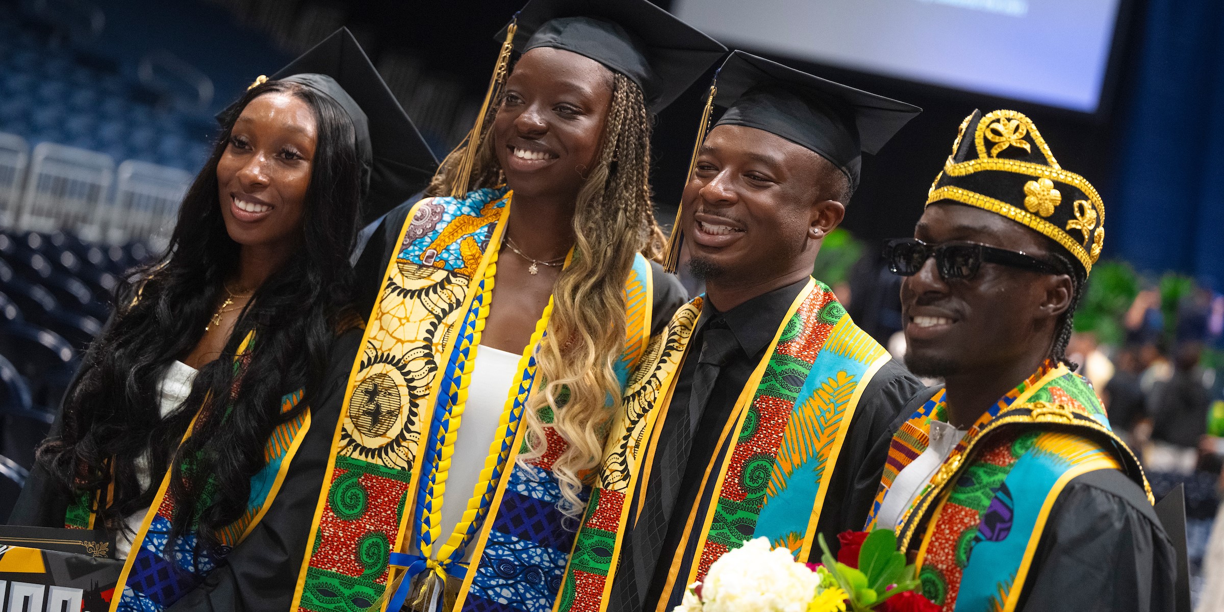 A group of graduating scholars smiling