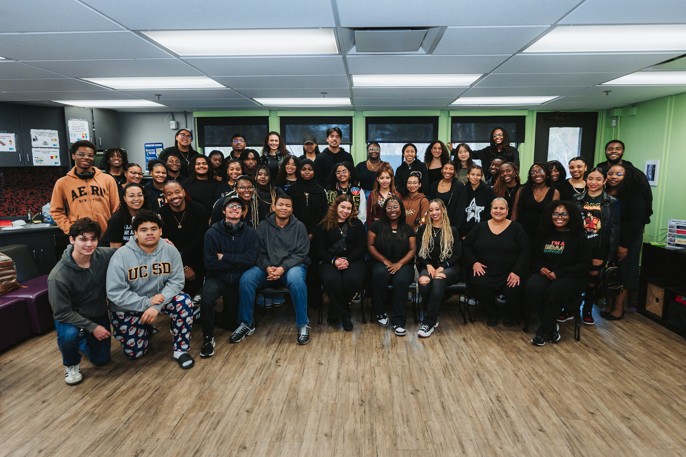 A large group of people pose for a photo. 