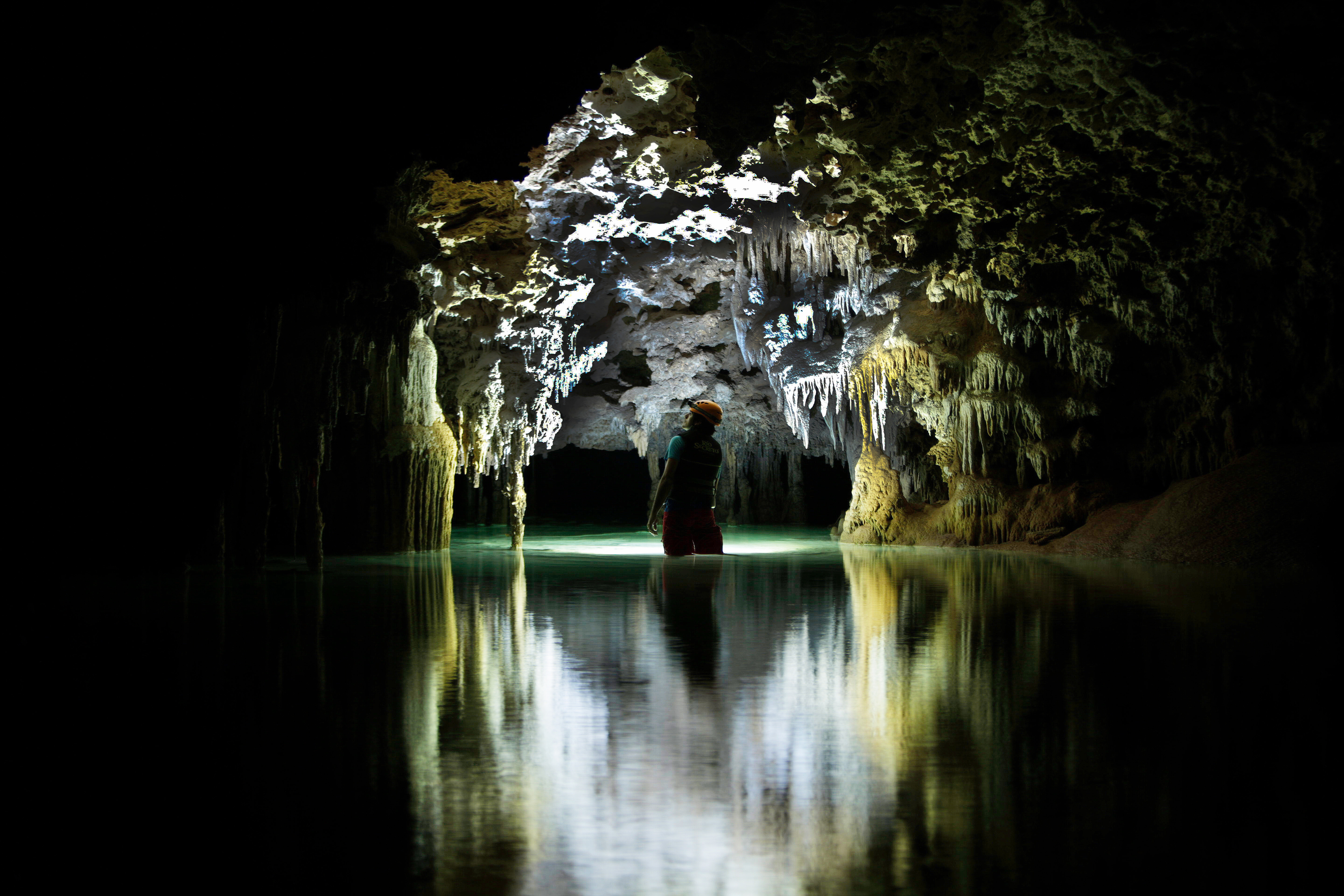 Photo showing a person inside a cave. Photo by Fabio Esteban Amador.