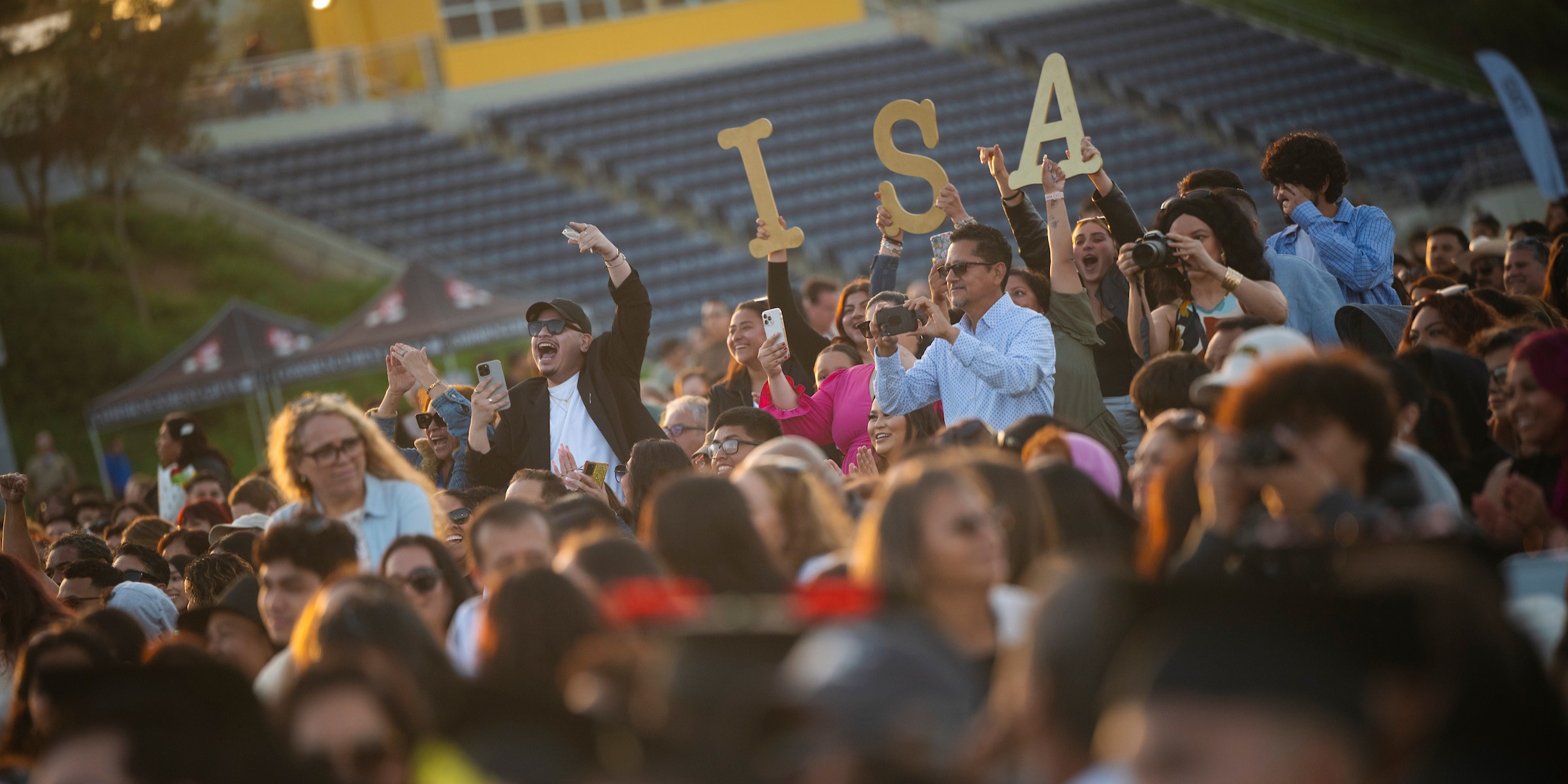 Family and friends cheering for their graduate