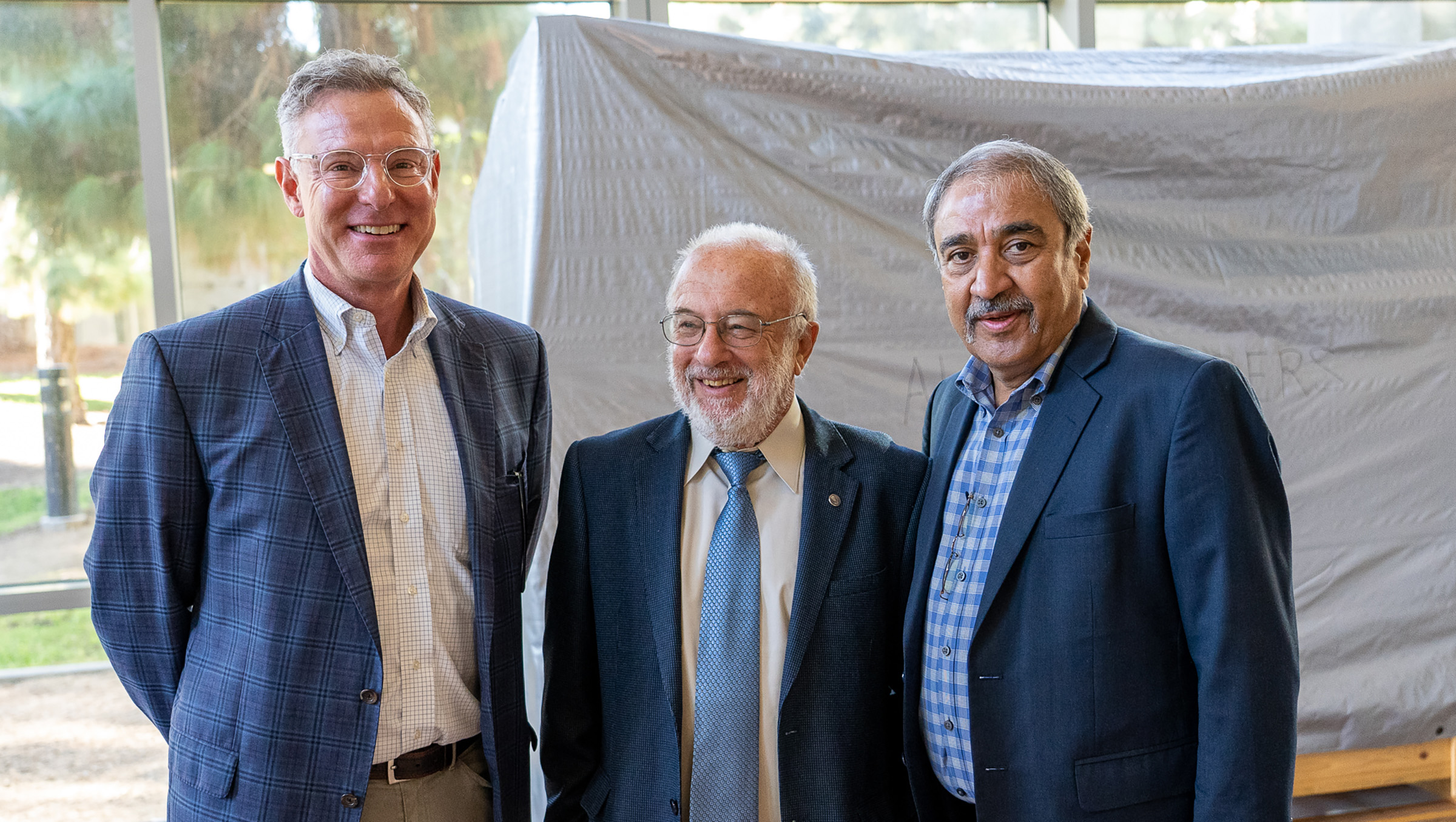 Rep. Scott Peters, Ivan Schuller and Pradeep Khosla.