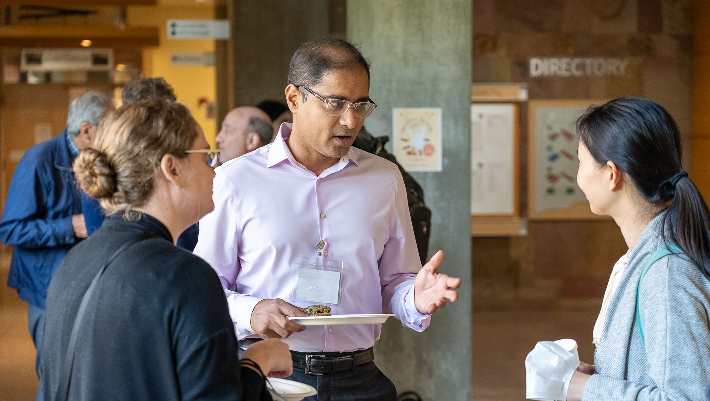 Shriram Ramanathan talking with attendees.
