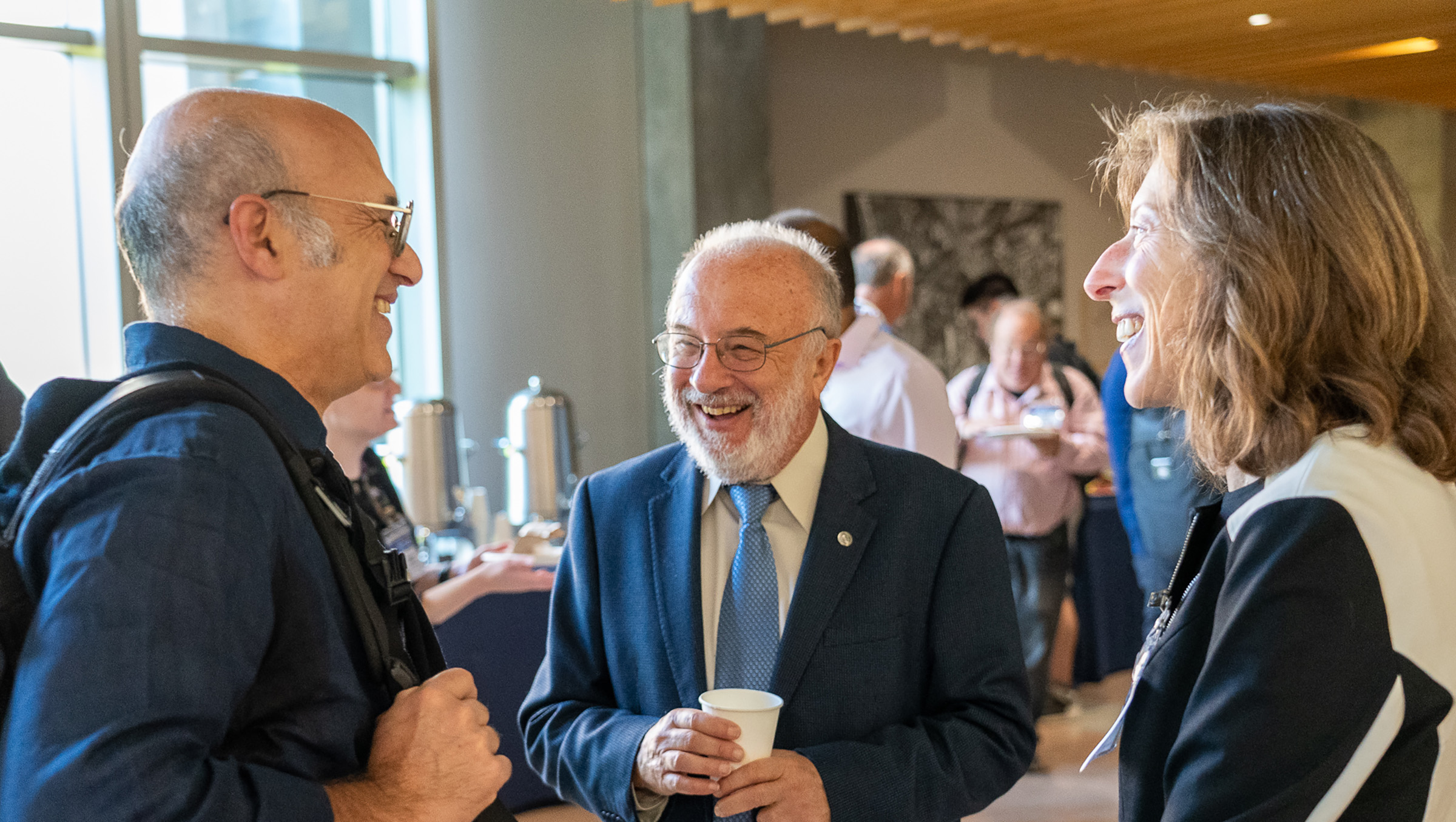 Attendees eating and talking.