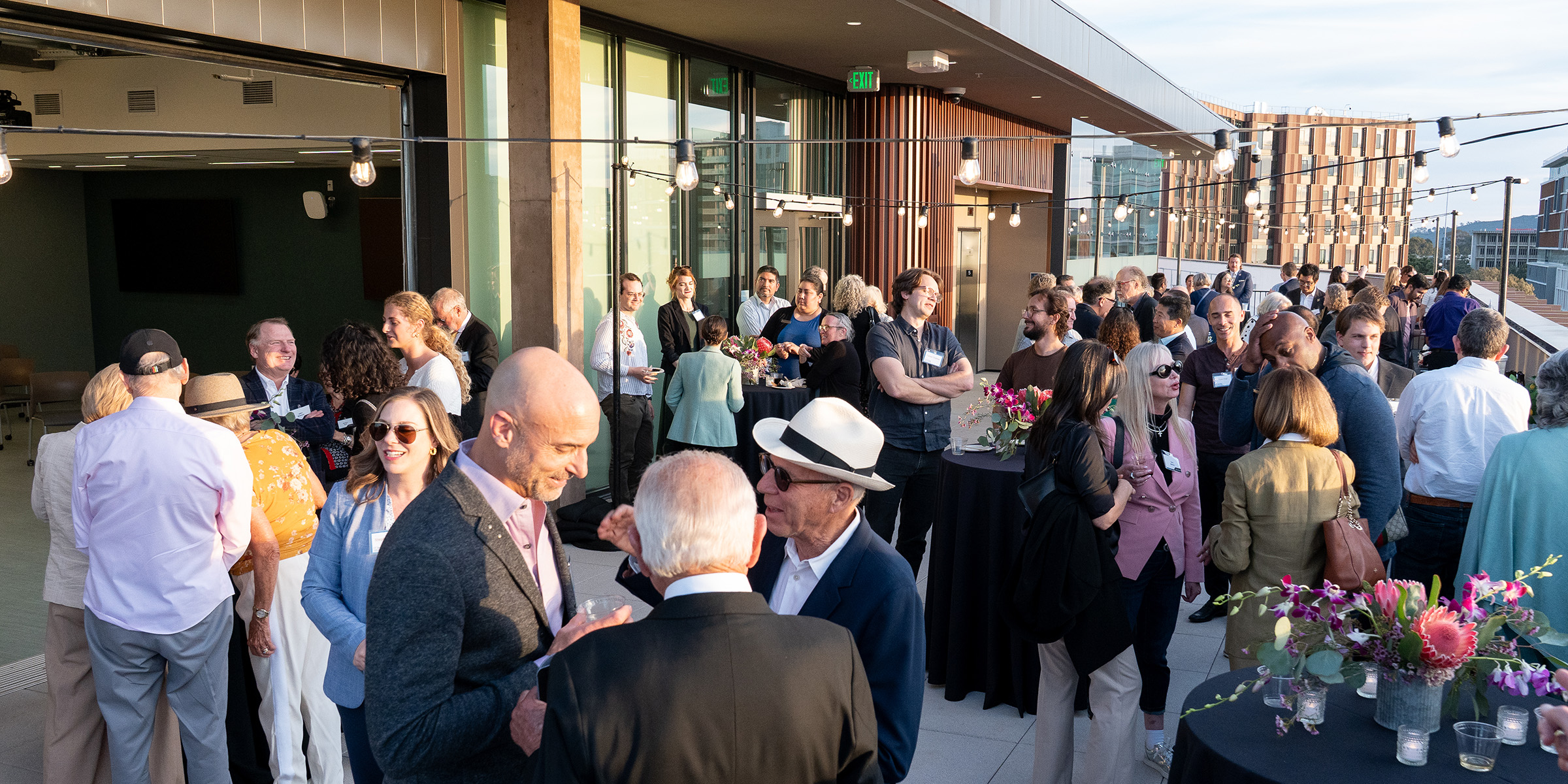 The Malk Hall rooftop space hosted a reception. People gathered to socialize and enjoy refreshments. 