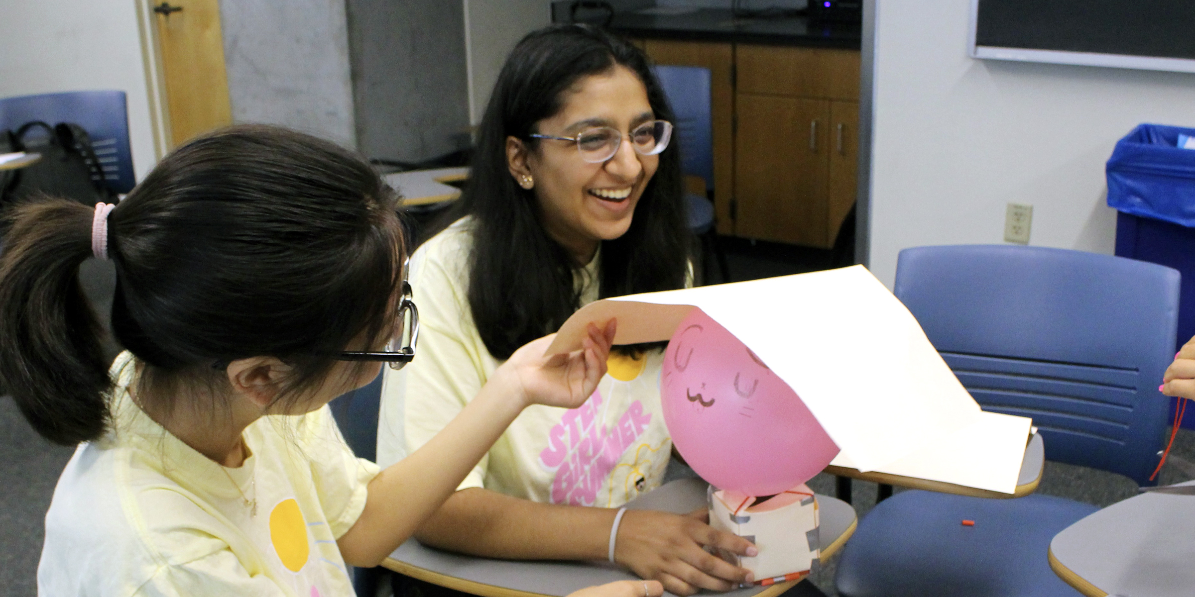 students decorate a balloon for an egg drop experiment