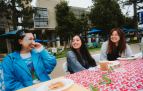 Slideshow: Three students laugh at a table