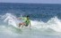 Slideshow: Surfer in green shirt on wave