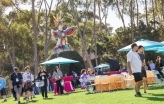 Slideshow: UC San Diego students and their families walk around Sun God Lawn during a breakfast. 