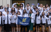 Slideshow: group photo of skagg students in their white coats