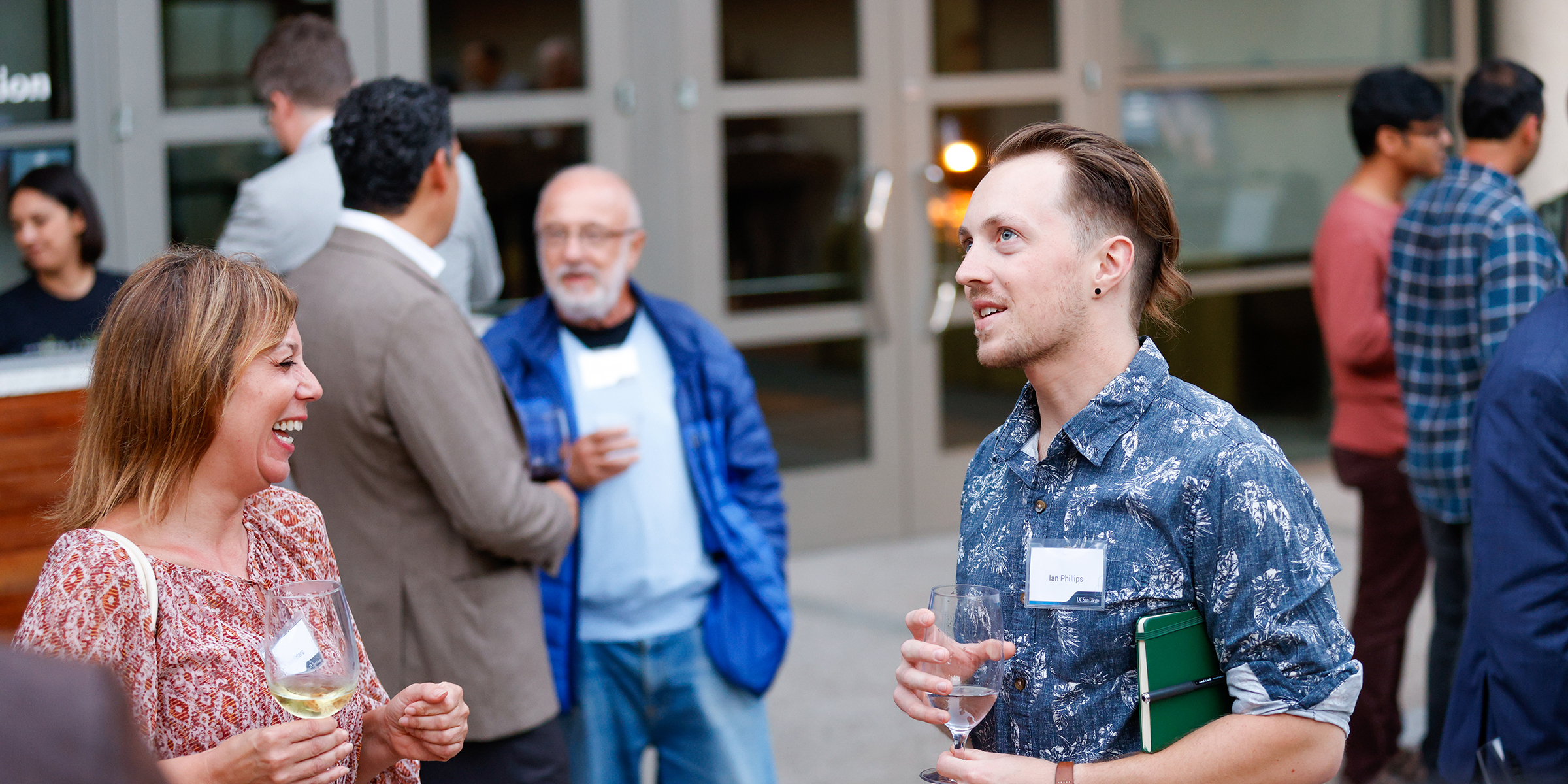 two people talking at reception