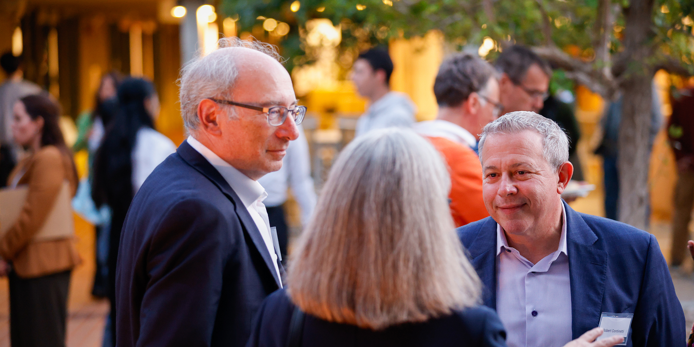 group of people talking at reception