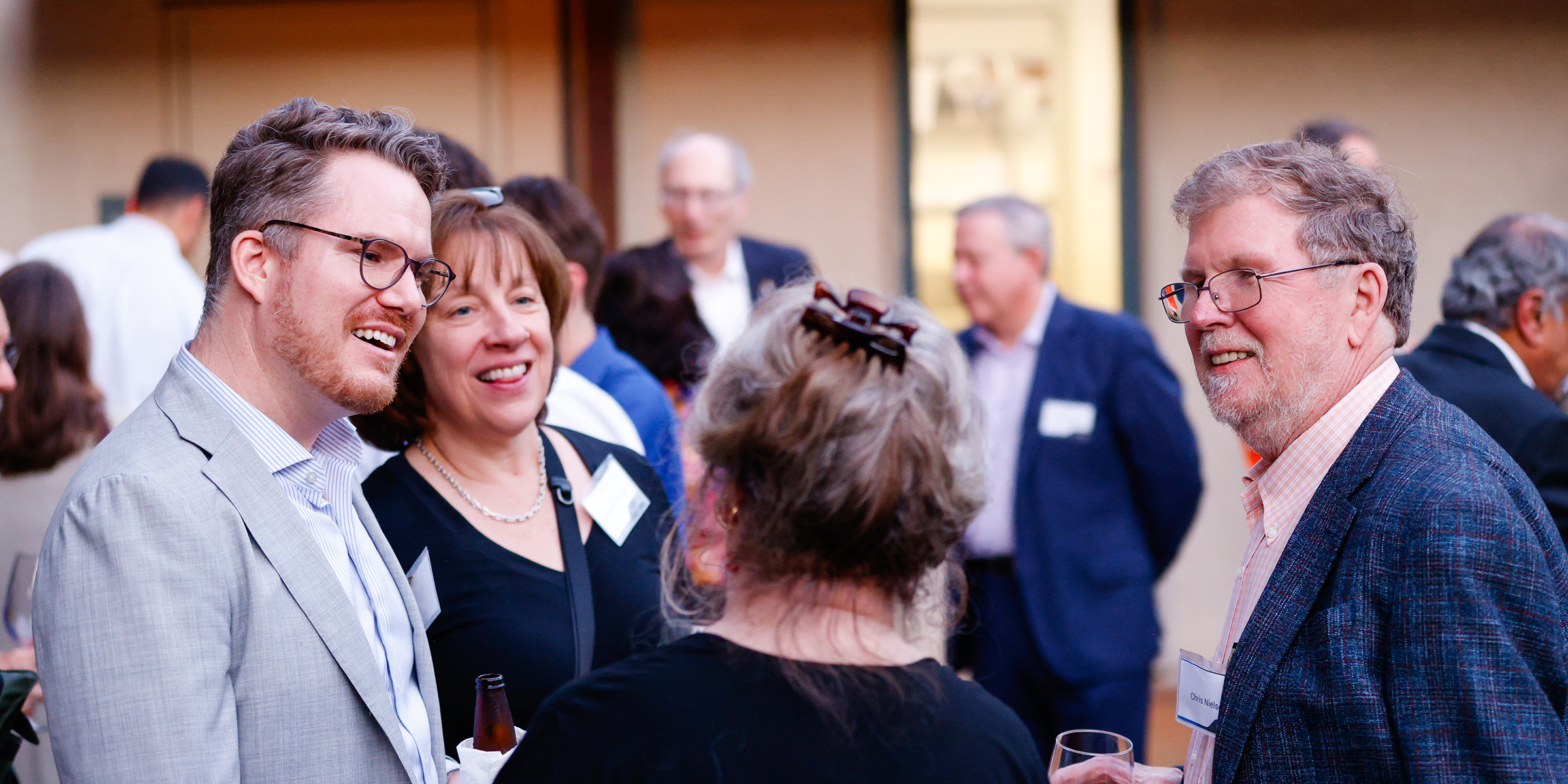 group of people talking at reception