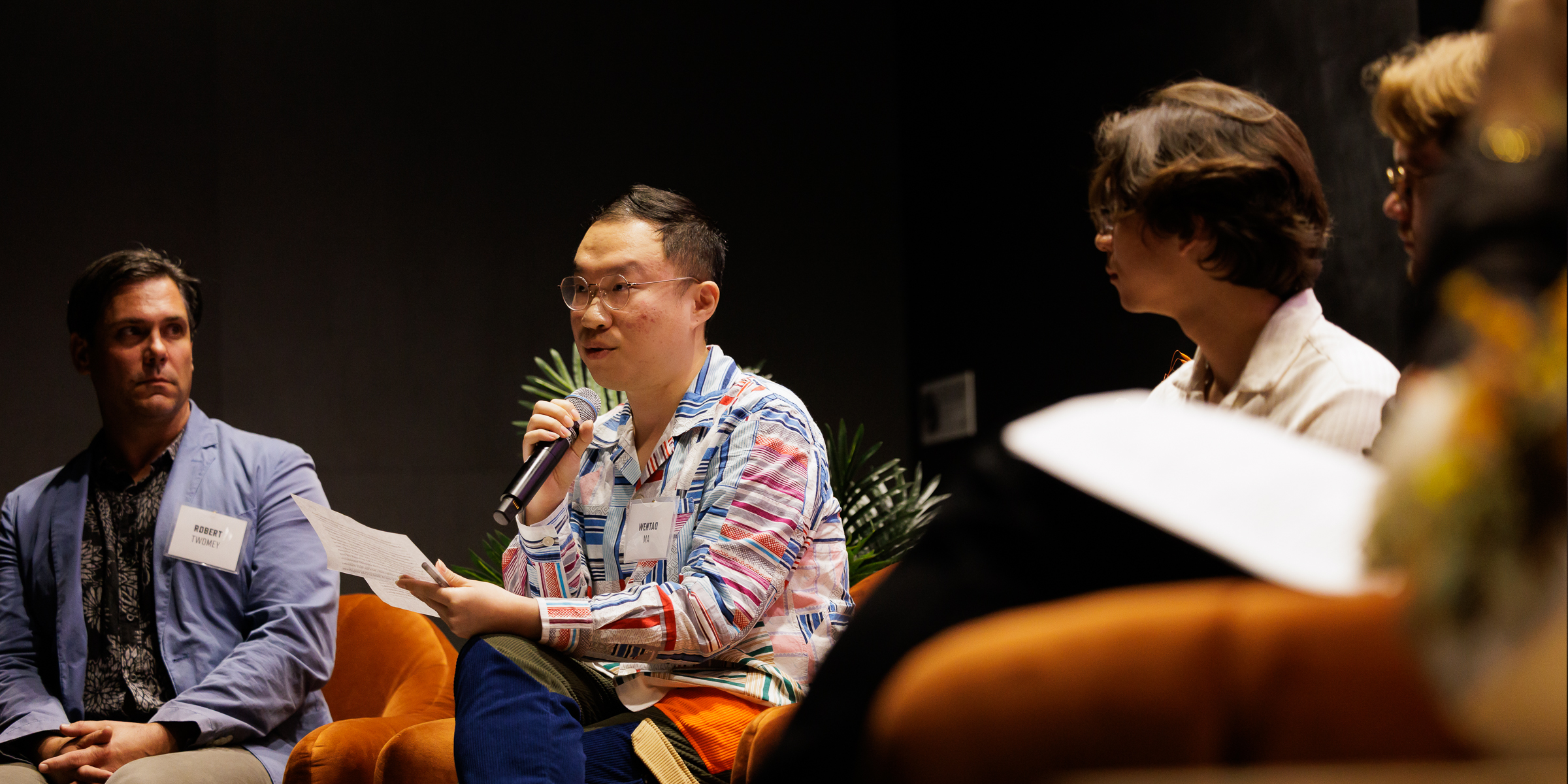 Panelist Wentao Mao speaks about their research project.