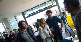A group of students network at UC San Diego's Design and Innovation Building.