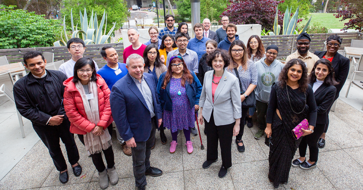 Standing group shot: Executive Vice Chancellor Elizabeth H. Simmons and Robert Continetti, Senior Associate Vice Chancellor for Academic Affairs with 2025-2026 UC San Diego Hellman Fellows and previous awardees.