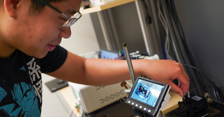 Man using machine with screen